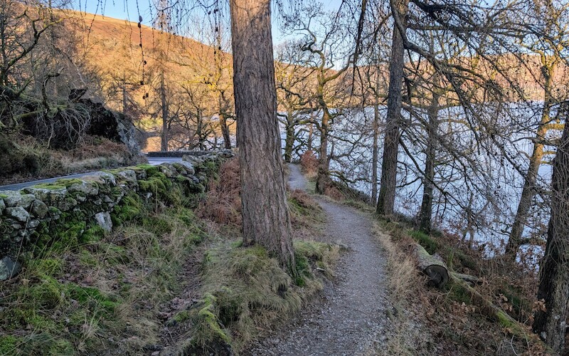 The path along the lakeside back to the start - thankfully off-road for the most part and nice to be on flatter ground - © Copyright 2025 Peter Burlingham, Days In The Lakes