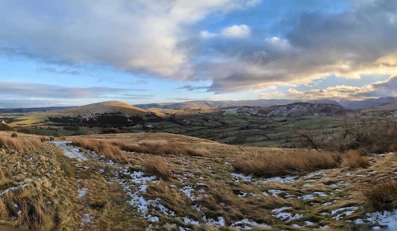 From the summit with Little Mell Fell on the left and you can see the fells on the far side of Ullswater to the right of that - © Copyright 2025 Peter Burlingham, Days In The Lakes