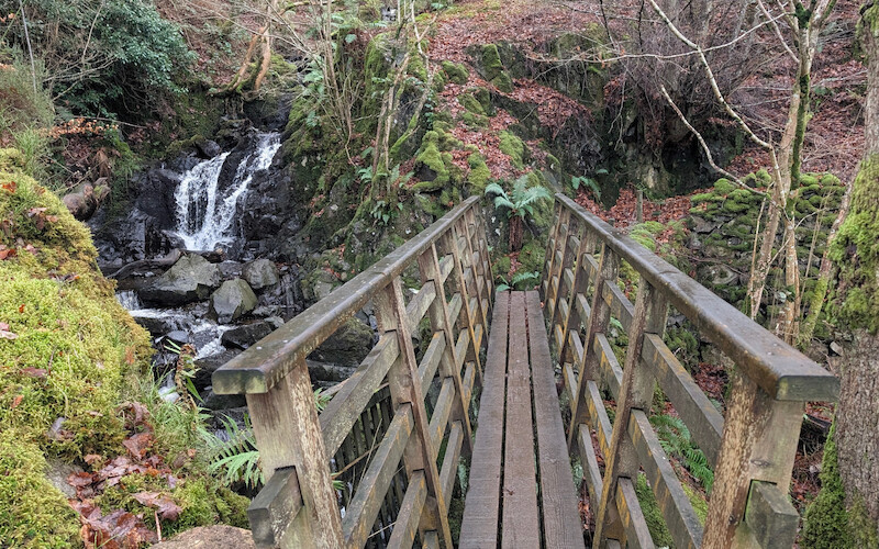 A scenic bridge and waterfall when crossing Cat Gill - © Copyright 2025 Peter Burlingham, Days In The Lakes