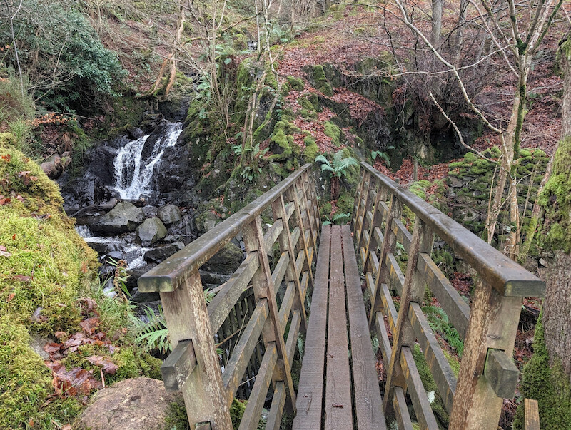 A scenic bridge and waterfall when crossing Cat Gill - © Copyright 2025 Peter Burlingham, Days In The Lakes