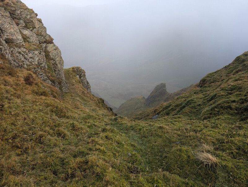 Dramatic, craggy view down a gulley from the ridge - © Copyright 2025 Peter Burlingham, Days In The Lakes