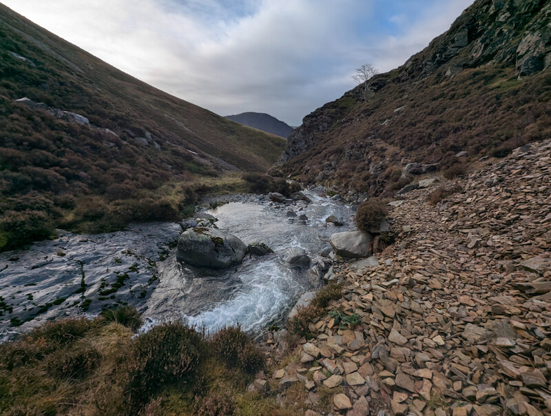 The path along the beck is badly eroded in places but still walkable - © Copyright 2025 Peter Burlingham, Days In The Lakes