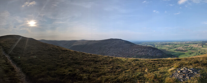 Once out of the bracken and running up the easier ridge, you get views to Carrock Fell to the north - one for another day - © Copyright 2025 Peter Burlingham, Days In The Lakes