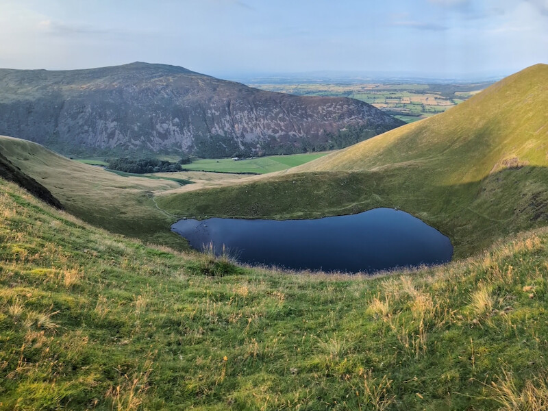 Heding north, Bowscale tarn comes into view which was stunning in the evening light - © Copyright 2025 Peter Burlingham, Days In The Lakes