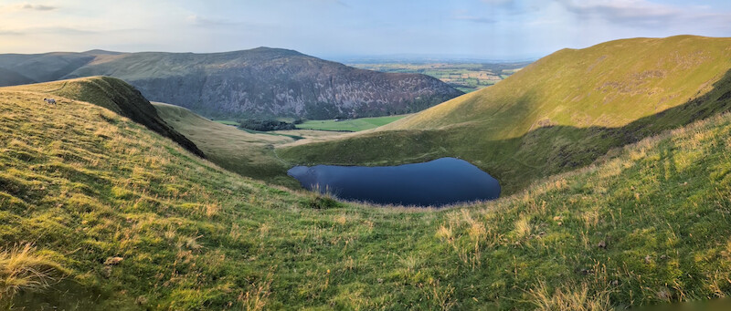 Heding north, Bowscale tarn comes into view which was stunning in the evening light - © Copyright 2025 Peter Burlingham, Days In The Lakes