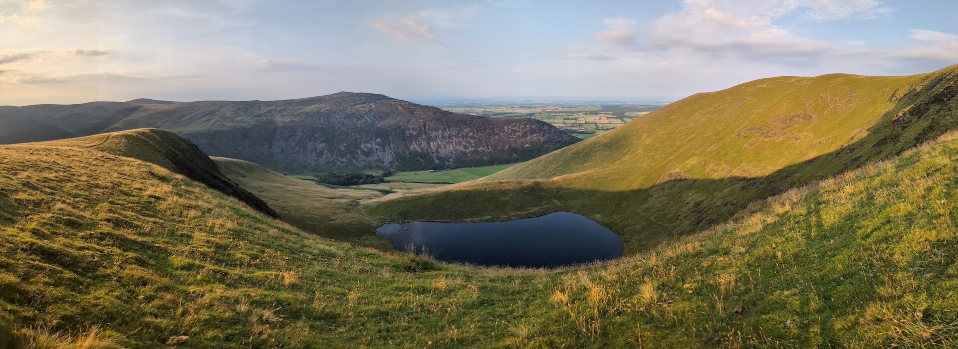 On Bowscale Fell looking down over Bowscale Tarn - © Copyright 2025 Peter Burlingham, Days In The Lakes