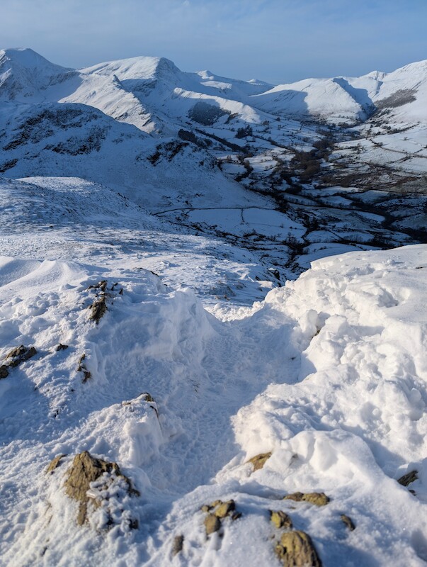 The snowdrifts were deeper south of the summit - © Copyright 2025 Peter Burlingham, Days In The Lakes